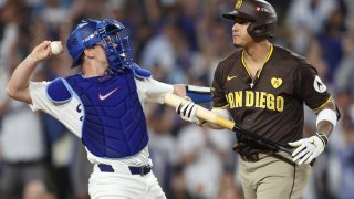 LOS ANGELES, CALIFORNIA – OCTOBER 11: Manny Machado #13 of the San Diego Padres reacts after striking out against the Los Angeles Dodgers during the seventh inning of Game Five of the Division Series at Dodger Stadium on October 11, 2024 in Los Angeles, California.  (Photo by Sean M. Haffey/Getty Images)