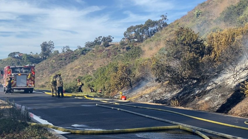 Fire crews mopping up hot spots Monday afternoon after a brush fire sparked in Hillcrest near state Route 163.