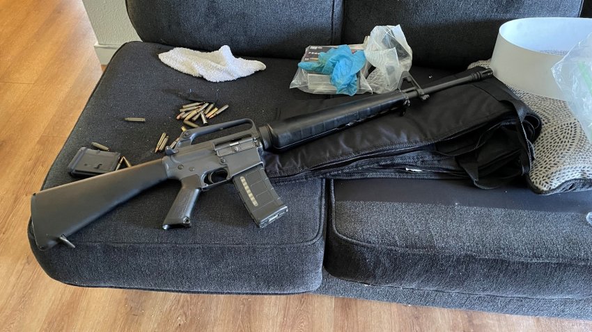 Police, who said they found a semi-automatic style rifle and several rounds of ammunition inside the apartment, identified the suspect as 45-year-old Travis Kingston Kirk.