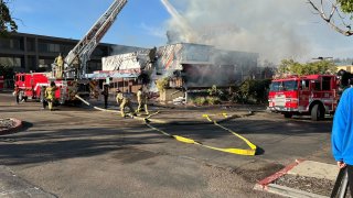 The closed down In Cahoots Dance Hall & Saloon in Mission Valley caught fire on Oct. 26, 2024. (NBC 7 San Diego)