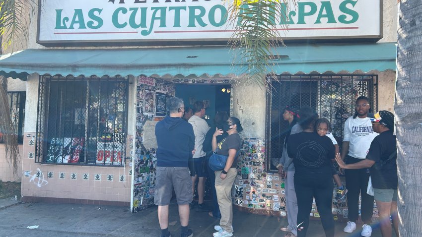 Folks line up outside for Mexican food at Las Cuatro Milpas in San Diego&#039;s Barrio Logan neighborhood on Oct. 25, 2024. (NBC 7 San Diego)