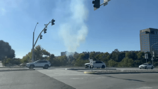 A fire burns in Mission Valley on Oct. 10, 2024.