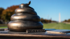 Statue of an apparent bronze poop emoji on Pelosi's desk joins DC's memorials