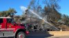 Poway brush fire causes evacuations, road closure