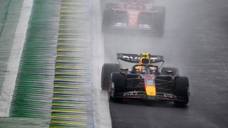 Sergio Perez of Mexico driving the (11) Oracle Red Bull Racing RB20 leads Carlos Sainz of Spain driving (55) the Ferrari SF-24 on track during the F1 Grand Prix of Brazil at Autodromo Jose Carlos Pace on November 03, 2024 in Sao Paulo, Brazil.