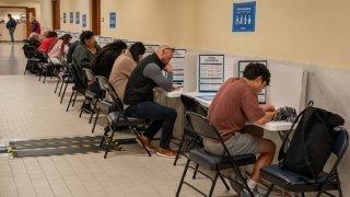 People vote at the San Francisco City Hall voting center on the final day of early voting ahead of Election Day, on November 4, 2024 in San Francisco, California. 