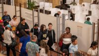 People stand in line at Honolulu Hale to cast their ballot to vote in this year’s general election in Honolulu, Hawaii, on November 5, 2024. 