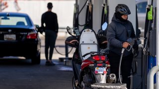 A man stops to fill up his motorcycle at a gas station on Rhode Island Avenue on November 26, 2024 in Washington, DC. 