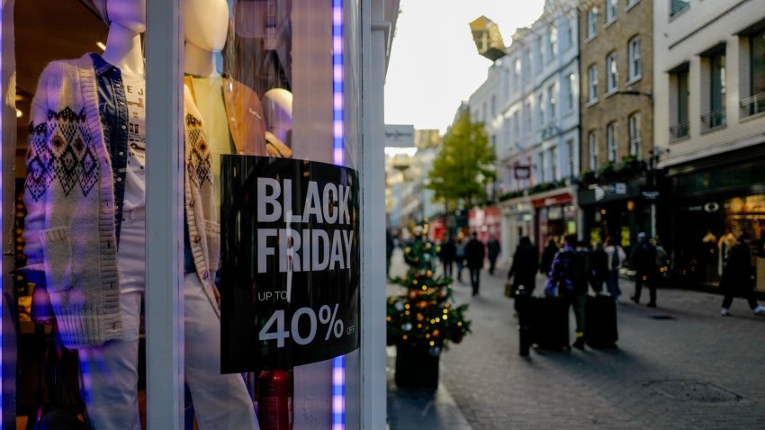 A Black Friday sign appears on a shop window in Carnaby Street, London, on November 25, 2024.