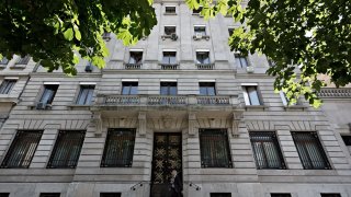 A pedestrian walks by the entrance to Lombard Odier in Geneva, Switzerland.