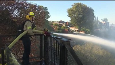 Evacuations lifted as crews battle brush fire near College Area