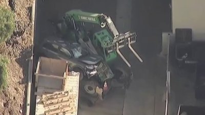 Car goes down embankment, crashes into forklift after police chase in National City