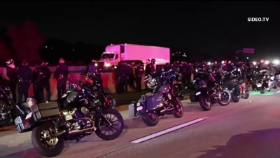 Police stop a large group of motorcyclists on the I-15 freeway