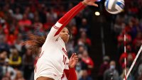 COLUMBUS, OH – DECEMBER 18: Devyn Robinson #10 of the Wisconsin Badgers hits the ball over the net against the Nebraska Cornhuskers during the Division I Womens Volleyball Championship on December 18, 2021 in Columbus, Ohio. (Photo by Jamie Schwaberow/NCAA Photos via Getty Images)