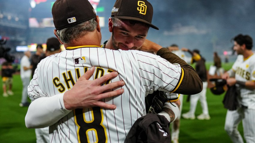 SAN DIEGO, CA – OCTOBER 02: Manager Mike Shildt #8 and Jackson Merrill #3 of the San Diego Padres interact after winning Game 2 of the Wild Card Series presented by T-Mobile 5G Home Internet between the Atlanta Braves and the San Diego Padres at Petco Park on Wednesday, October 2, 2024 in San Diego, California. The San Diego Padres won 5-4 and will advance to the National League Division Series. (Photo by Daniel Shirey/MLB Photos via Getty Images)