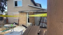 Police tape blocks off an abandoned house after a deadly shootout in National City on Nov. 16, 2024. (NBC 7 San Diego)