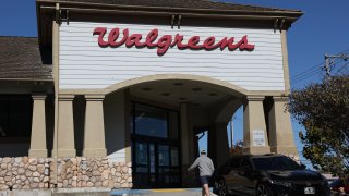 A sign is posted on the exterior of a Walgreens store on October 15, 2024 in Mill Valley, California. 