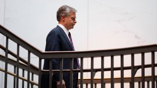 FBI Director Christopher Wray walks into a secure information area ahead of a closed-door security meeting on Capitol Hill in Washington on Sept. 25, 2024.