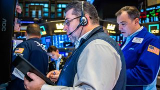 Traders work at the New York Stock Exchange on Dec. 17, 2024.