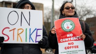 Starbucks Workers United members picket outside a Starbucks store in Chicago, Illinois, US, on Friday, Dec. 20, 2024. 