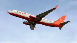 A Jeju Air Boeing 737-800 taking off from Osaka Kansai airport.