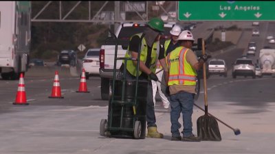 Lanes slowly reopening after big-rig crash caused oil spill on I-805