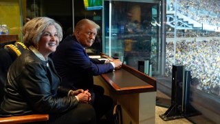 Donald Trump sits with Susie Wiles