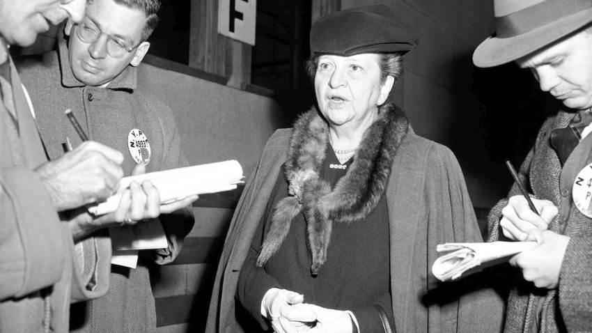 Former Secretary of Labor Frances Perkins chats with reporters in New York, Nov. 27, 1945