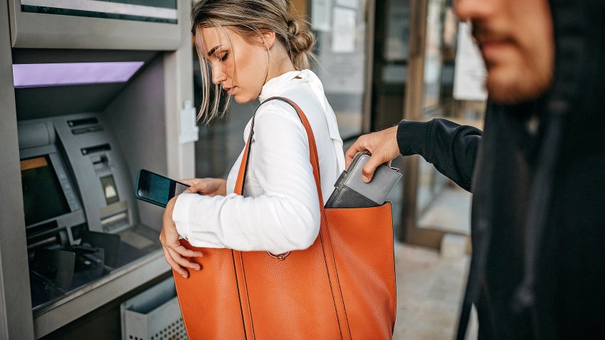 Man stealing money and personal stuff from woman