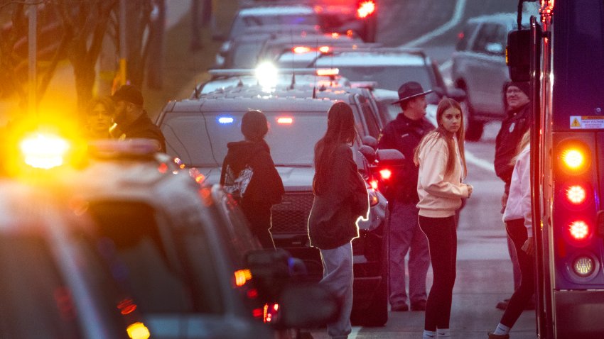 MADISON, WISCONSIN – DECEMBER 16: Students are escorted from a church next to the Abundant Life Christian School and loaded on busses to be taken to a reunification center on December 16, 2024 in Madison, Wisconsin. A student and teacher were shot and killed and the alleged shooter, who police say they believe to have been a student at the school, was found dead at the scene, according to published reports. Six others were injured with two in critical condition, the reports said.  (Photo by Scott Olson/Getty Images)