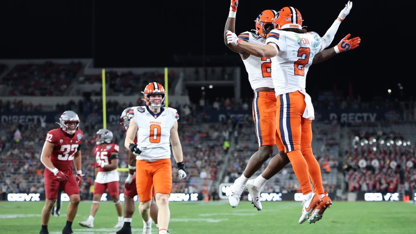 SAN DIEGO, CALIFORNIA – DECEMBER 27: Yasin Willis #23 congratulates Trebor Pena #2 of the Syracuse Orange after a pass play for a touchdown during the first half of the DirecTV Holiday Bowl against the Syracuse Orange at Snapdragon Stadium on December 27, 2024 in San Diego, California. (Photo by Sean M. Haffey/Getty Images)