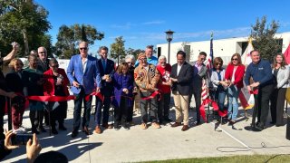 Members of the San Diego AIDS Memorial Task Force join other advocates and politicians, Sunday, for a ribbon-cutting ceremony.