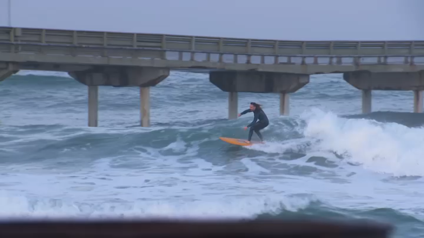 A surfer hits the waves in Ocean Beach, San Diego, Dec. 13, 2024.