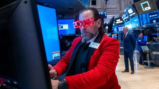 Traders work on the floor of the New York Stock Exchange on the last day of trading for the year on Dec. 31, 2024 in New York City. 