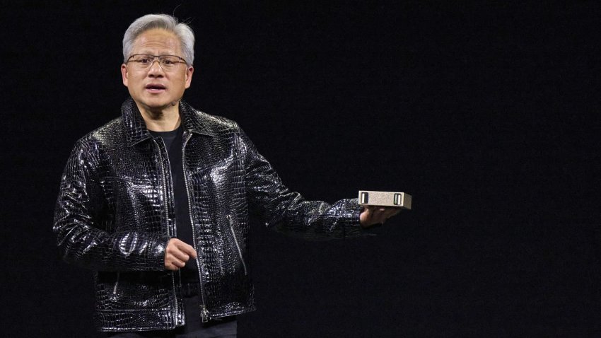 Jensen Huang, co-founder and chief executive officer of Nvidia Corp., speaks while holding a Project Digits computer during the 2025 CES event in Las Vegas, Nevada, US, on Monday, Jan. 6, 2025. Huang announced a raft of new chips, software and services, aiming to stay at the forefront of artificial intelligence computing. Photographer: Bridget Bennett/Bloomberg via Getty Images