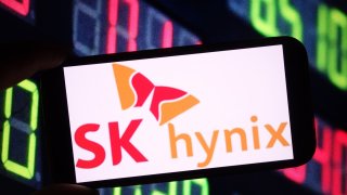 Illustration of the SK Hynix company logo seen displayed on a smartphone screen.