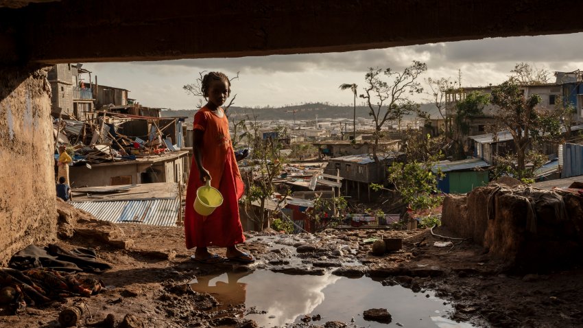 A young girl walks in the Kaweni slum on the outskirts of Mamoudzou, in the French Indian Ocean island of Mayotte, Thursday, Dec. 19, 2024, after Cyclone Chido.