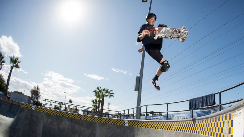 Skateboarder Tony Hawk performs a trick as his role as an ambassador for shoe company Vans.