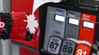 A person fills up a fuel tank at a pay-at-the-pump gasoline station in Edmonton, on January 30, 2025, in Edmonton, AB, Canada.