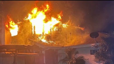 Family members rescue loved ones from burning Bay Terraces home