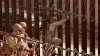 Marines install barbed wire along border fence separating Tijuana from San Diego