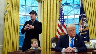 President Donald Trump listens as Elon Musk, joined by his son, speaks in the Oval Office at the White House, Tuesday, Feb. 11, 2025, in Washington.