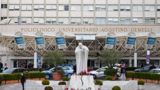 A statue of Pope John Paul II is seen in front of the Agostino Gemelli Polyclinic, in Rome, Monday, Feb. 17, 2025, where Pope Francis has been hospitalized to undergo some necessary diagnostic tests and to continue his ongoing treatment for bronchitis.