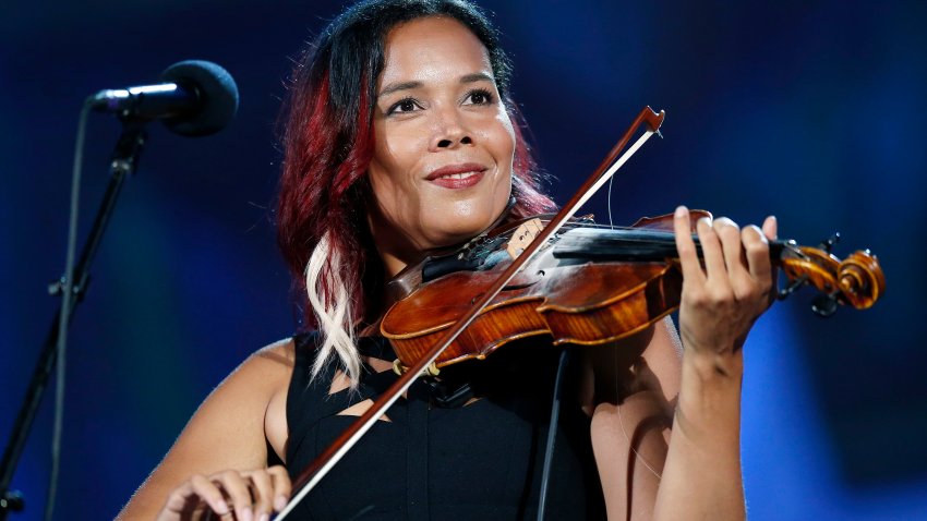 FILE – Rhiannon Giddens performs during rehearsal for the Boston Pops Fireworks Spectacular in Boston, on July 3, 2018.