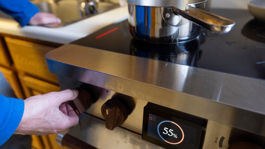 Ed Yaker boils water on a Copper stove