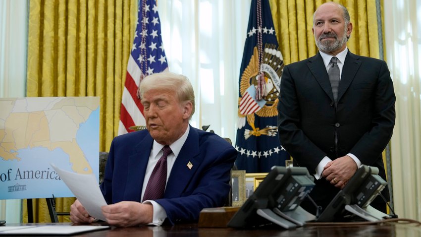 Commerce Secretary nominee Howard Lutnick listens as President Donald Trump speaks after signing an executive order in the Oval Office of the White House, Thursday, Feb. 13, 2025, in Washington.