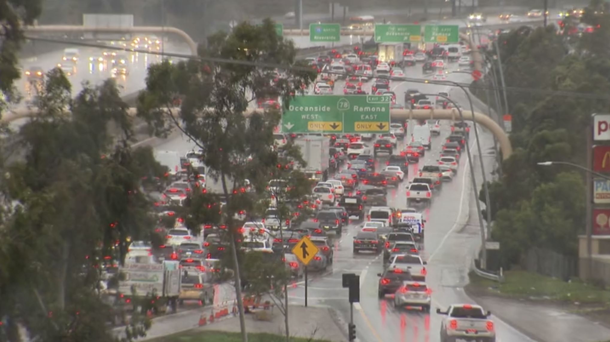 Rain and wind gusts slowed traffic on Interstate 15 in North County San Diego on Feb. 13, 2025.