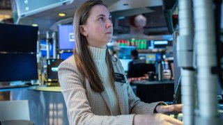 Traders work on the floor of the New York Stock Exchange on Feb. 13, 2025.