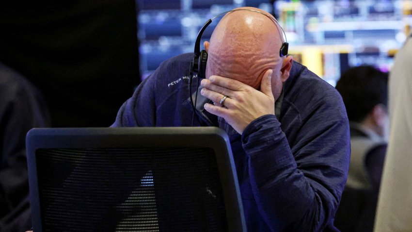 A trader reacts while working on the floor of the New York Stock Exchange on Feb. 25, 2025.