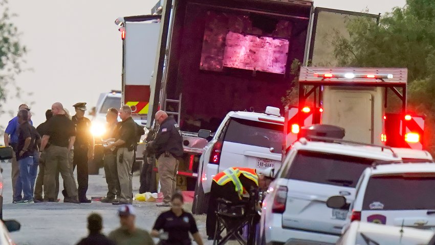 Police and other first responders work the scene where officials say dozens of people have been found dead and multiple others were taken to hospitals with heat-related illnesses after a semitrailer containing suspected migrants was found, Monday, June 27, 2022, in San Antonio.